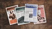 Footsteps magazine issues on a wooden desk.