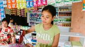 A young person working in a shop. Photo: Tom Price/Integral Alliance