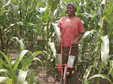 Purity Mgobo in Kenya with the jab planter she used to sow her maize crop. Photo: Saidi Mkomwa/ACT