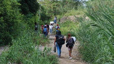 Many people are making the dangerous journey from Venezuela into Colombia on foot.