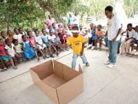 Education Supervisor Tamara Olicoeur teaches children in Siloye Village, Haiti, about hygiene and sanitation.