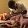 A nurse checks the baby’s heartbeat. Photo: Richard Hanson/Tearfund