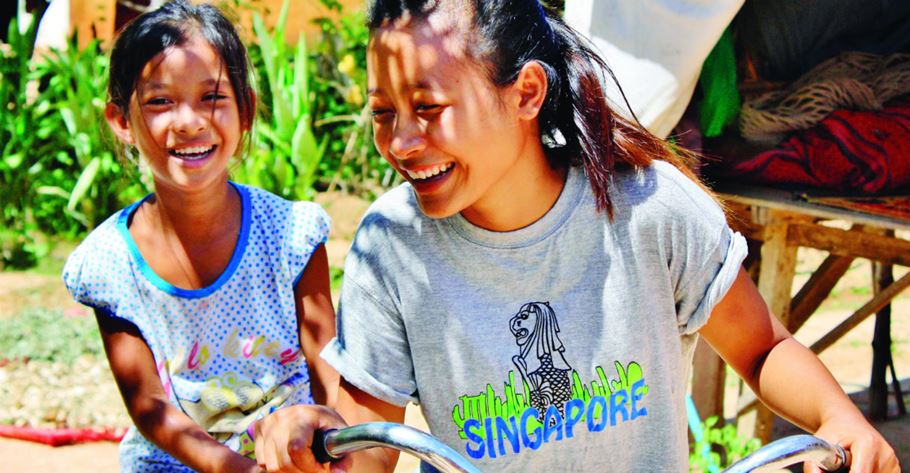 After Chenda was orphaned at the age of eight, she was mentored by a young woman from her church. Now aged 18, Chenda has become an Alongsider mentor herself to Vary, whose mother also died. Photo: Hanna Tzou/Alongsiders