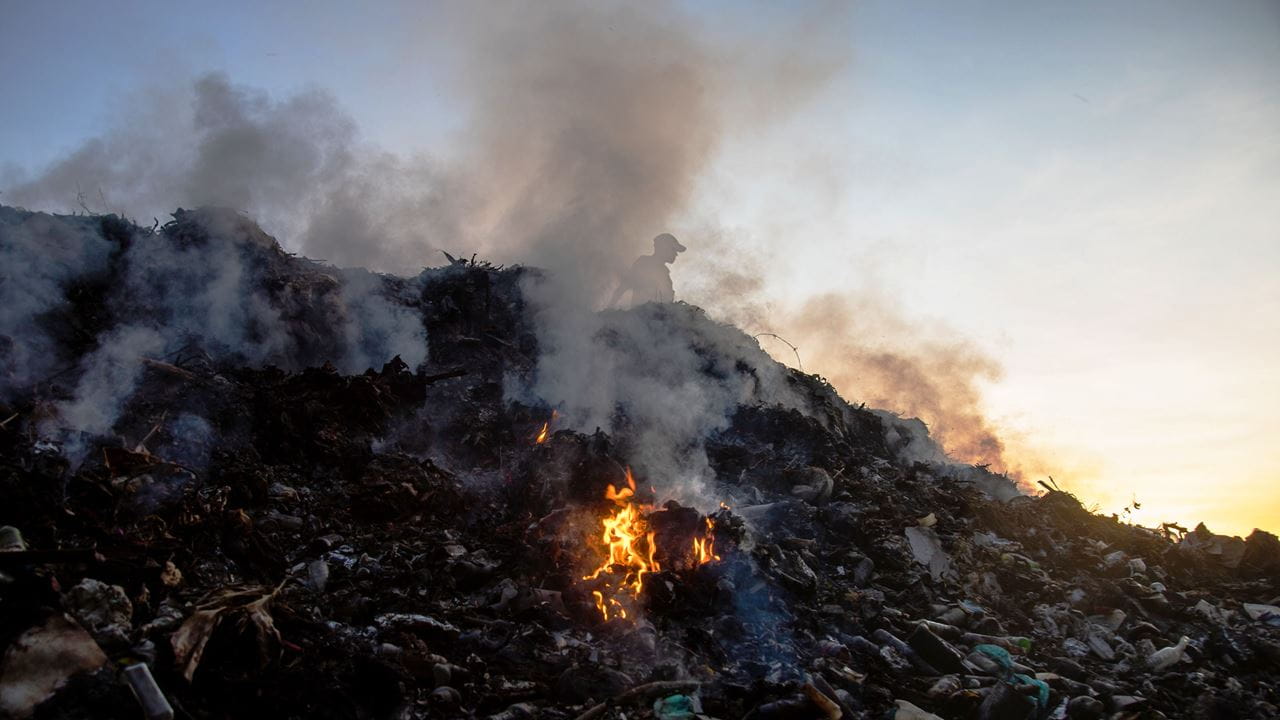 A pile of waste burning in Tanzania.