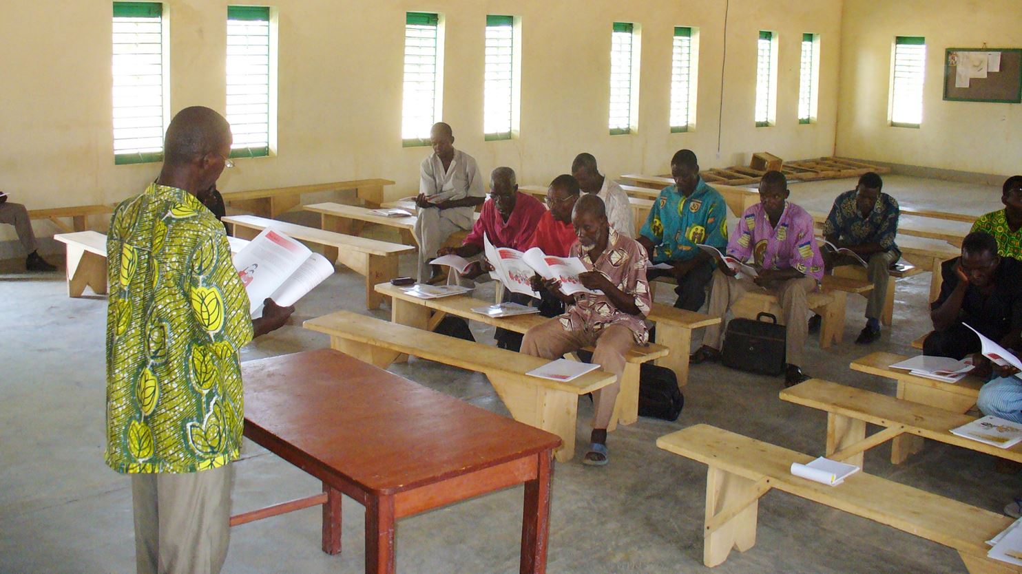 A group of pastors in a church at Komsilga in Burkina Faso reading 'Pillars' (2009)