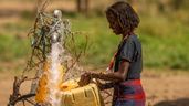 A member of the local community gathers fresh, clean water in Ethiopia